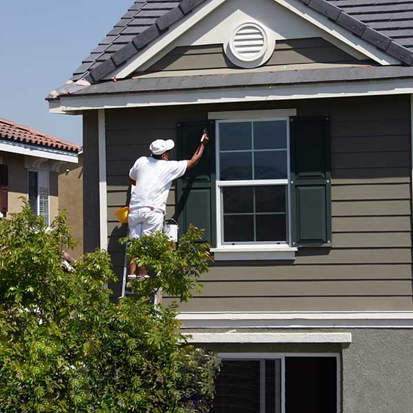 Man working on a house window